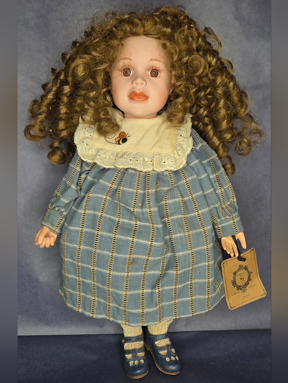 Vintage-Style Porcelain Doll with Blue Plaid Dress